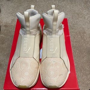 Women Puma slip on sneakers.